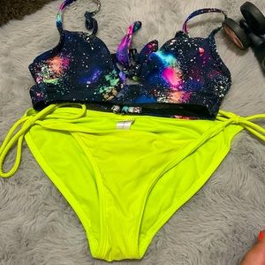 I am selling a bikini bottoms are yellow top is galaxy